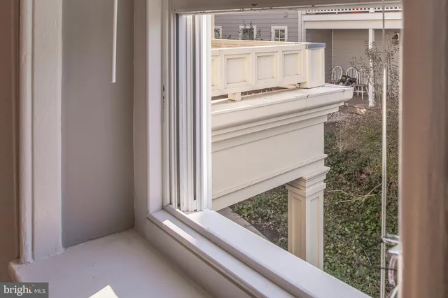 a kitchen with stainless steel appliances granite countertop wooden cabinets a sink and dishwasher with wooden floor