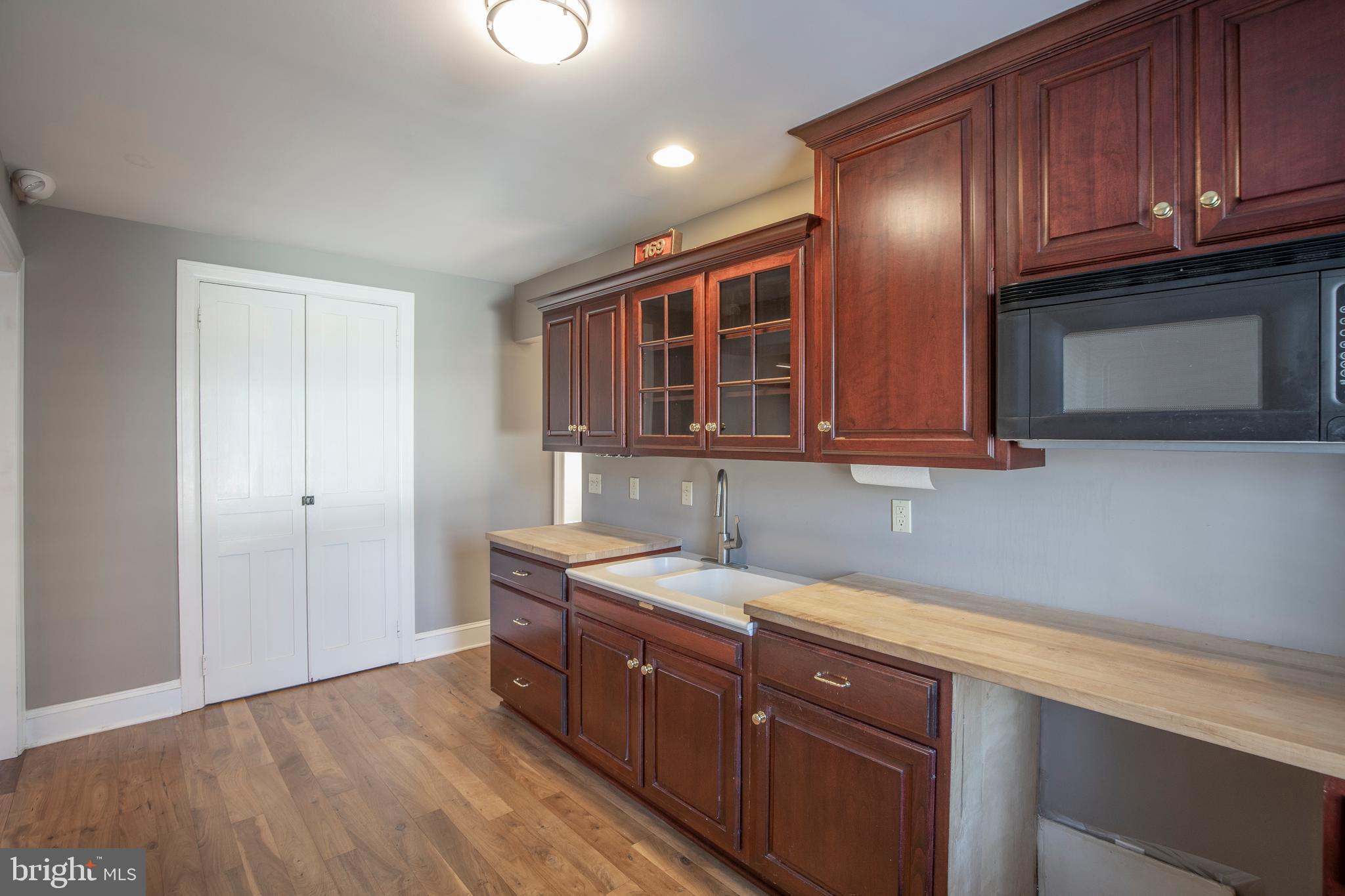 169 North Main Street Doylestown, PA 18901 - Photo 46 of 53 a kitchen with stainless steel appliances granite countertop wooden cabinets a sink and dishwasher
