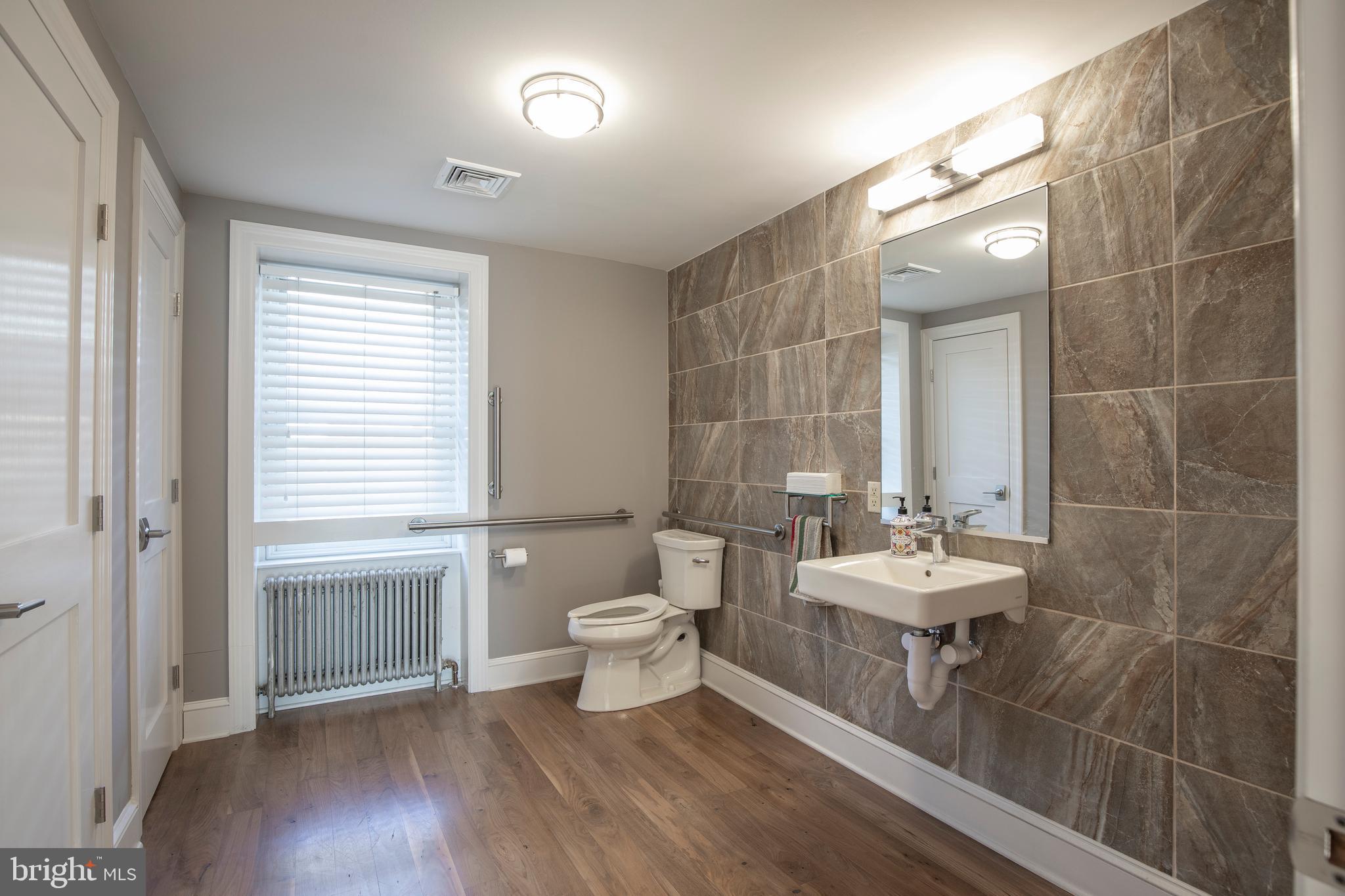 169 North Main Street Doylestown, PA 18901 - Photo 49 of 53 a bathroom with a toilet a sink and mirror