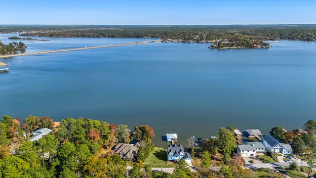 an aerial view of a houses with ocean view