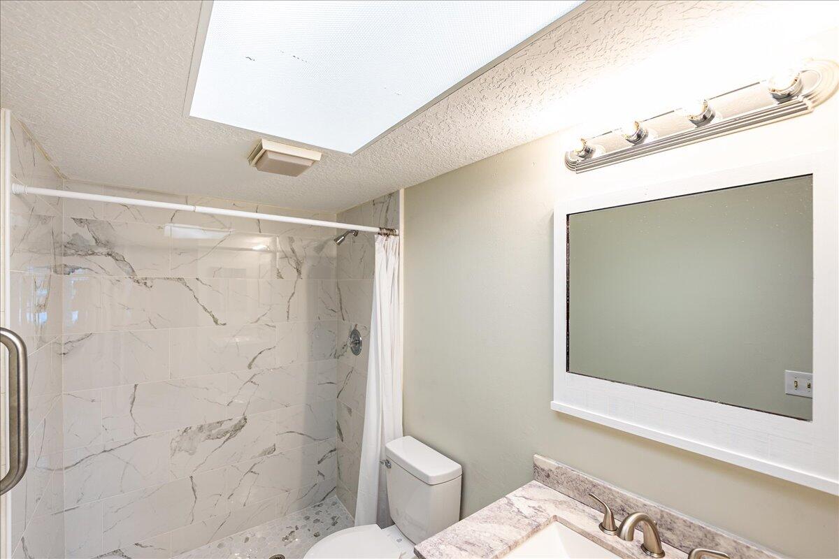 950 South Kanner Highway, Unit E4 Stuart, FL 34994 - Photo 14 of 33 a bathroom with a shower and a sink