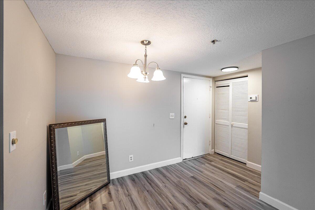 950 South Kanner Highway, Unit E4 Stuart, FL 34994 - Photo 20 of 33 a view of room with wooden floor