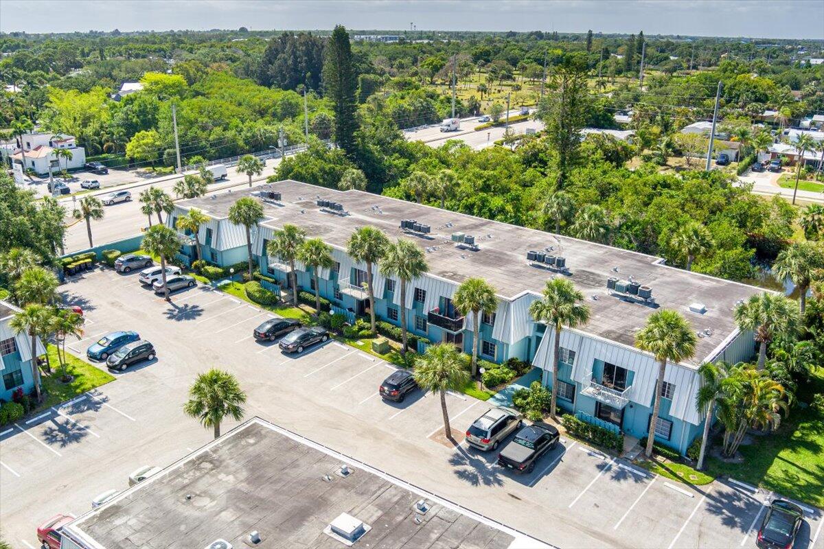 950 South Kanner Highway, Unit E4 Stuart, FL 34994 - Photo 28 of 33 an aerial view of residential houses with outdoor space