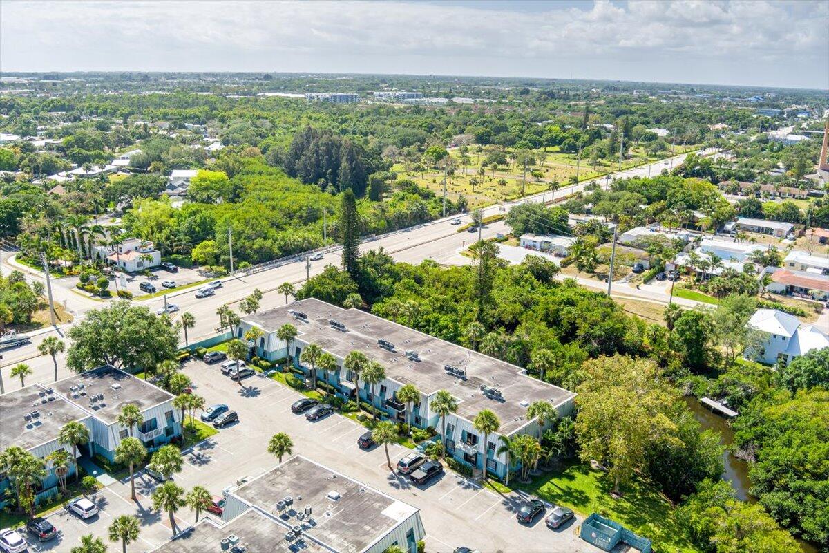 950 South Kanner Highway, Unit E4 Stuart, FL 34994 - Photo 29 of 33 an aerial view of residential houses with outdoor space