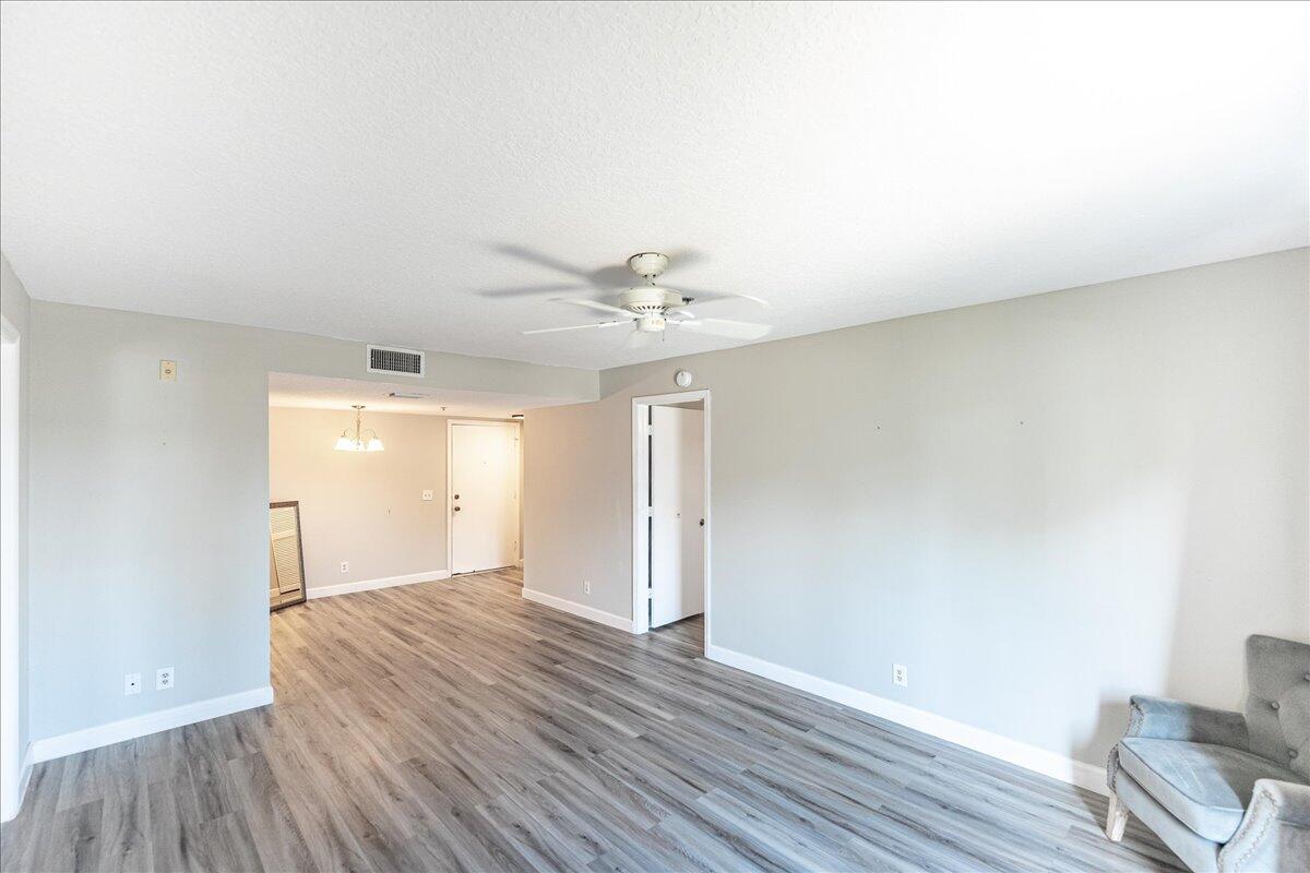 950 South Kanner Highway, Unit E4 Stuart, FL 34994 - Photo 6 of 33 a view of a livingroom with wooden floor