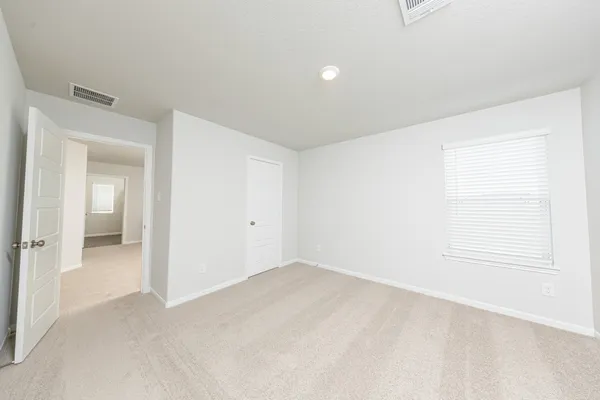 an empty room with a bathroom