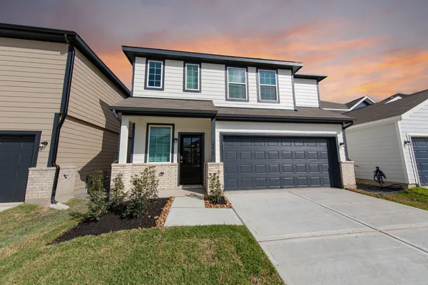 front view of a house with a yard