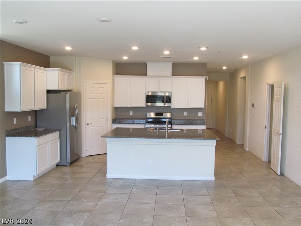 2157 Rio Rancho Pointe Place Henderson, NV 89002 - Photo 3 of 24 A well-appointed kitchen features stainless steel appliances, granite countertops, and an inviting island for casual dining.