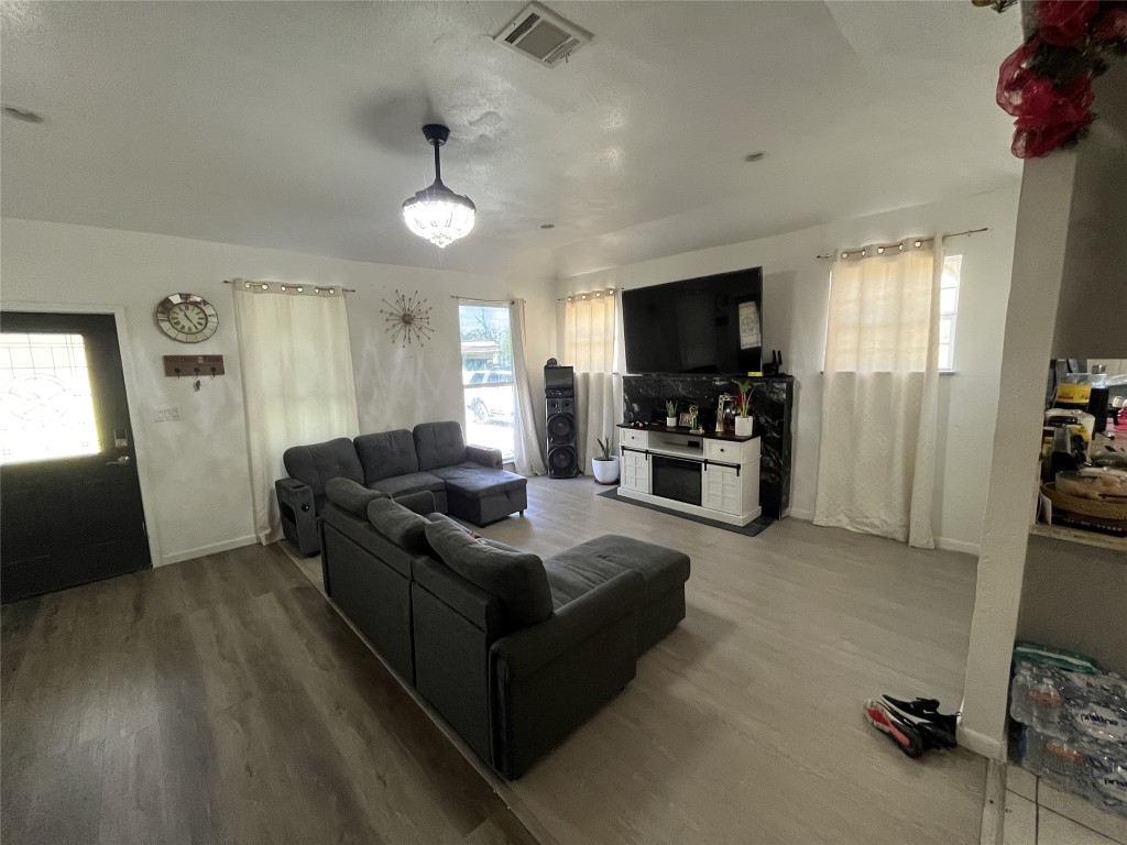 925 Lear Street Houston, TX 77015 - Photo 2 of 9 a living room with furniture and a flat screen tv