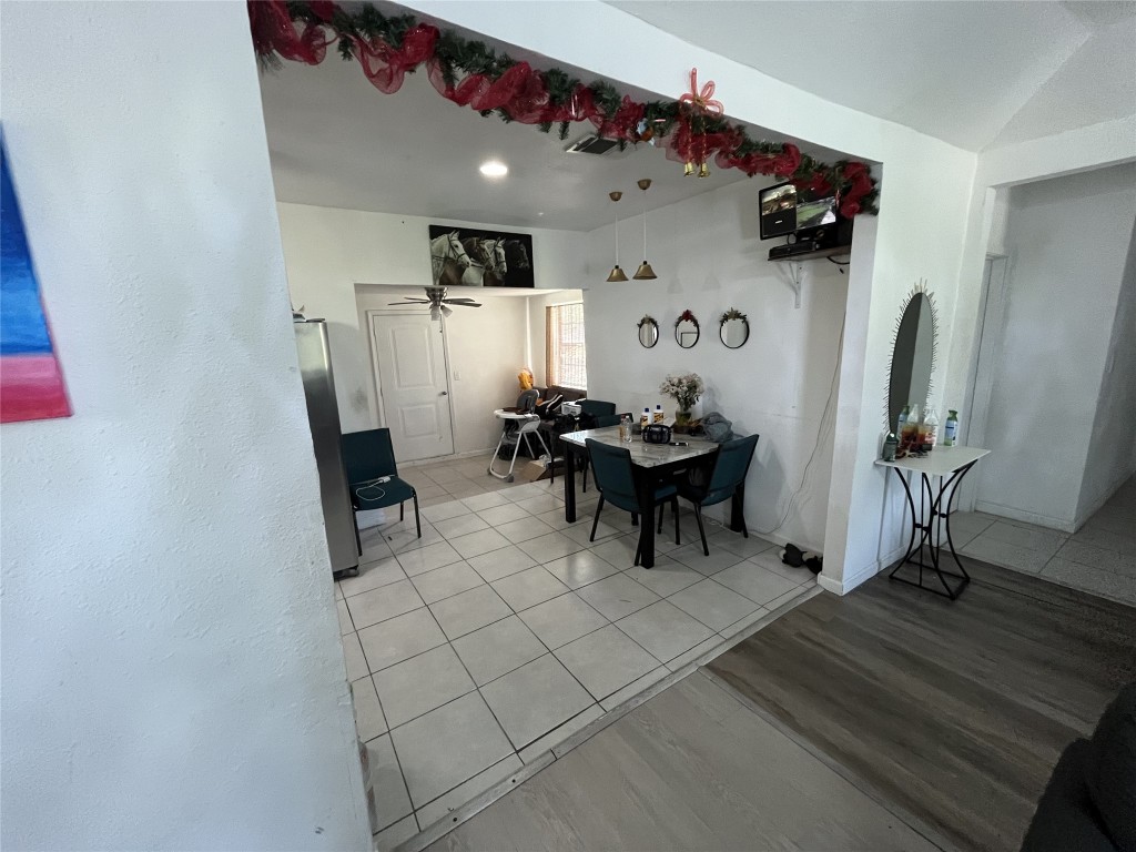 925 Lear Street Houston, TX 77015 - Photo 4 of 9 a view of a workspace with furniture and wooden floor