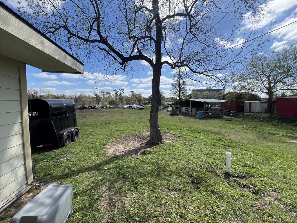 925 Lear Street Houston, TX 77015 - Photo 8 of 9 a view of a garden with a bench