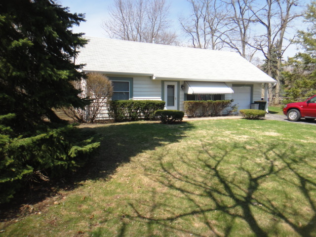 5718 South Peck Avenue Countryside, IL 60525 - Photo 2 of 12 a view of a house with a yard and tree s