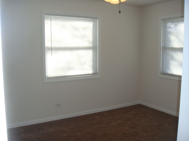 5718 South Peck Avenue Countryside, IL 60525 - Photo 8 of 12 an empty room with a window