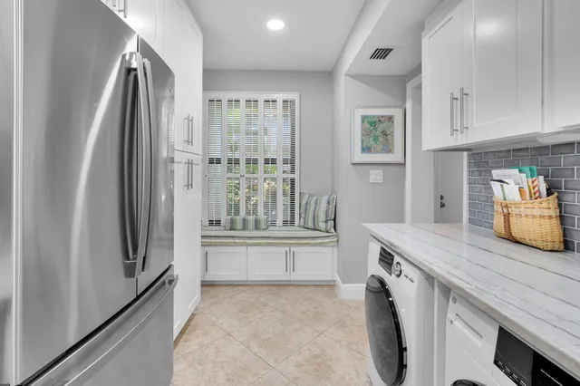a bedroom with furniture and a flat screen tv