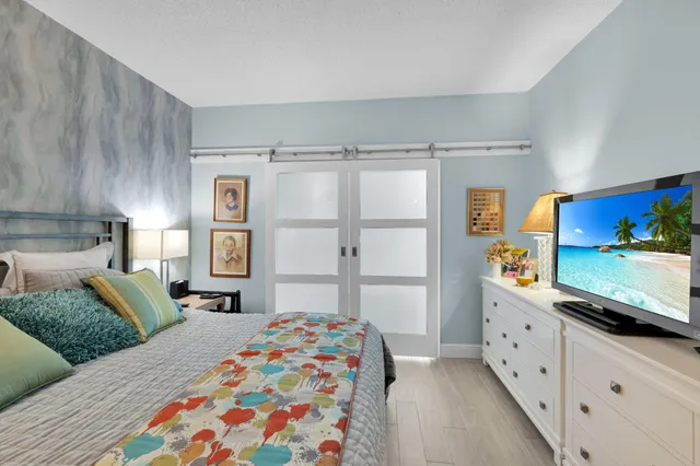 a view of a trees in a yard with a house