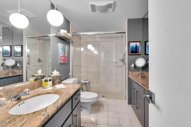 an aerial view of residential houses with outdoor space and street view