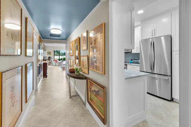 a living room with furniture and a large mirror