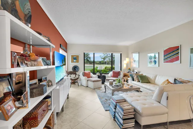 a kitchen with refrigerator and car parked