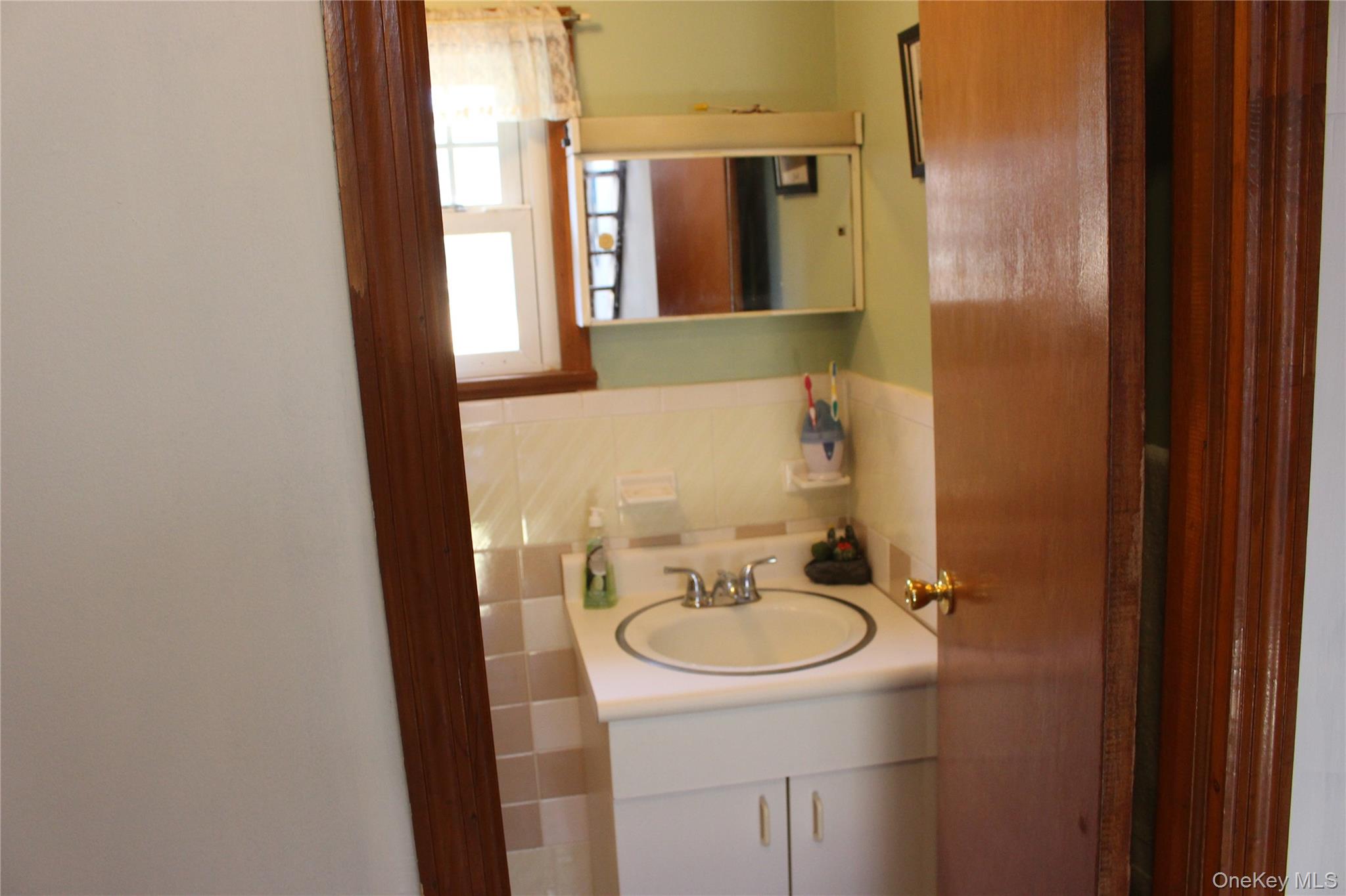 154 Britman Road Mongaup Valley, NY 12762 - Photo 11 of 38 a bathroom with a sink and mirror