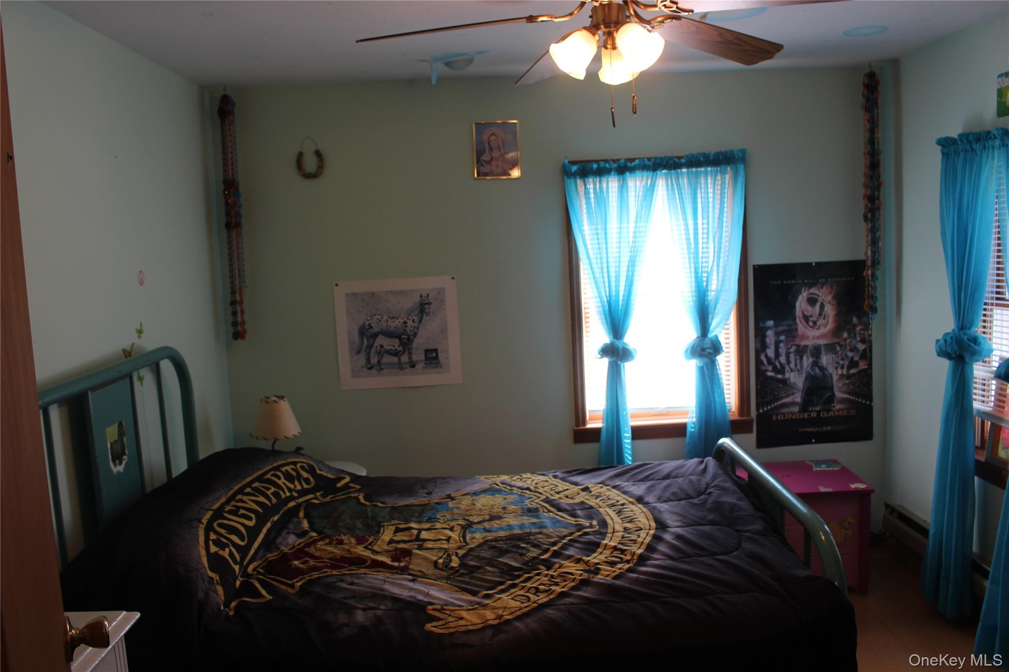 154 Britman Road Mongaup Valley, NY 12762 - Photo 13 of 38 a bedroom with a bed and window