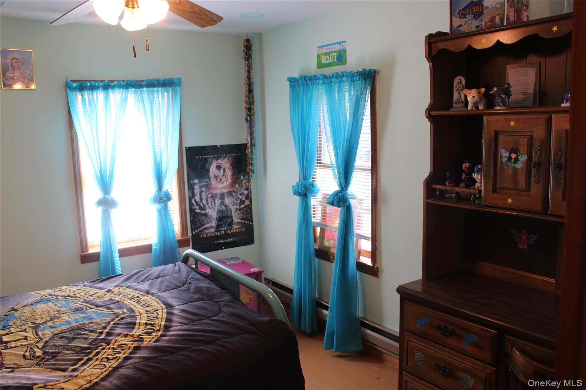 154 Britman Road Mongaup Valley, NY 12762 - Photo 14 of 38 a bedroom with a bed and a chandelier