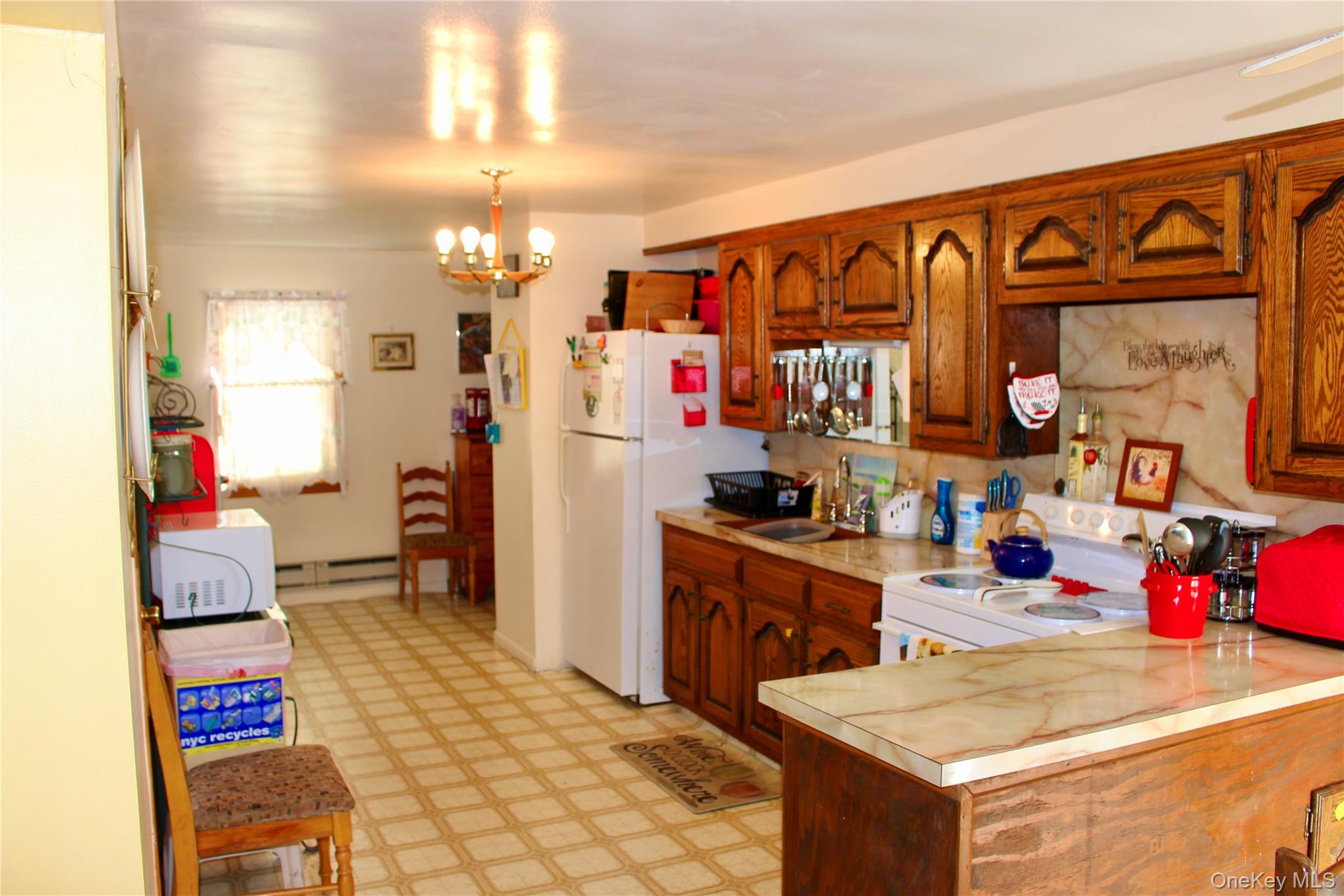 154 Britman Road Mongaup Valley, NY 12762 - Photo 28 of 38 a kitchen that has a lot of cabinets a sink and a stove in it