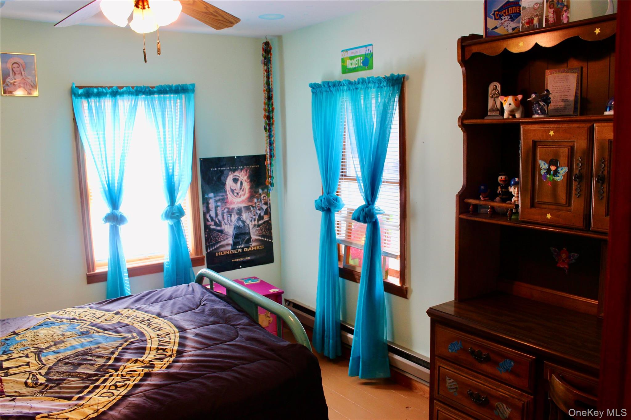 154 Britman Road Mongaup Valley, NY 12762 - Photo 33 of 38 a bedroom with a bed and a chandelier