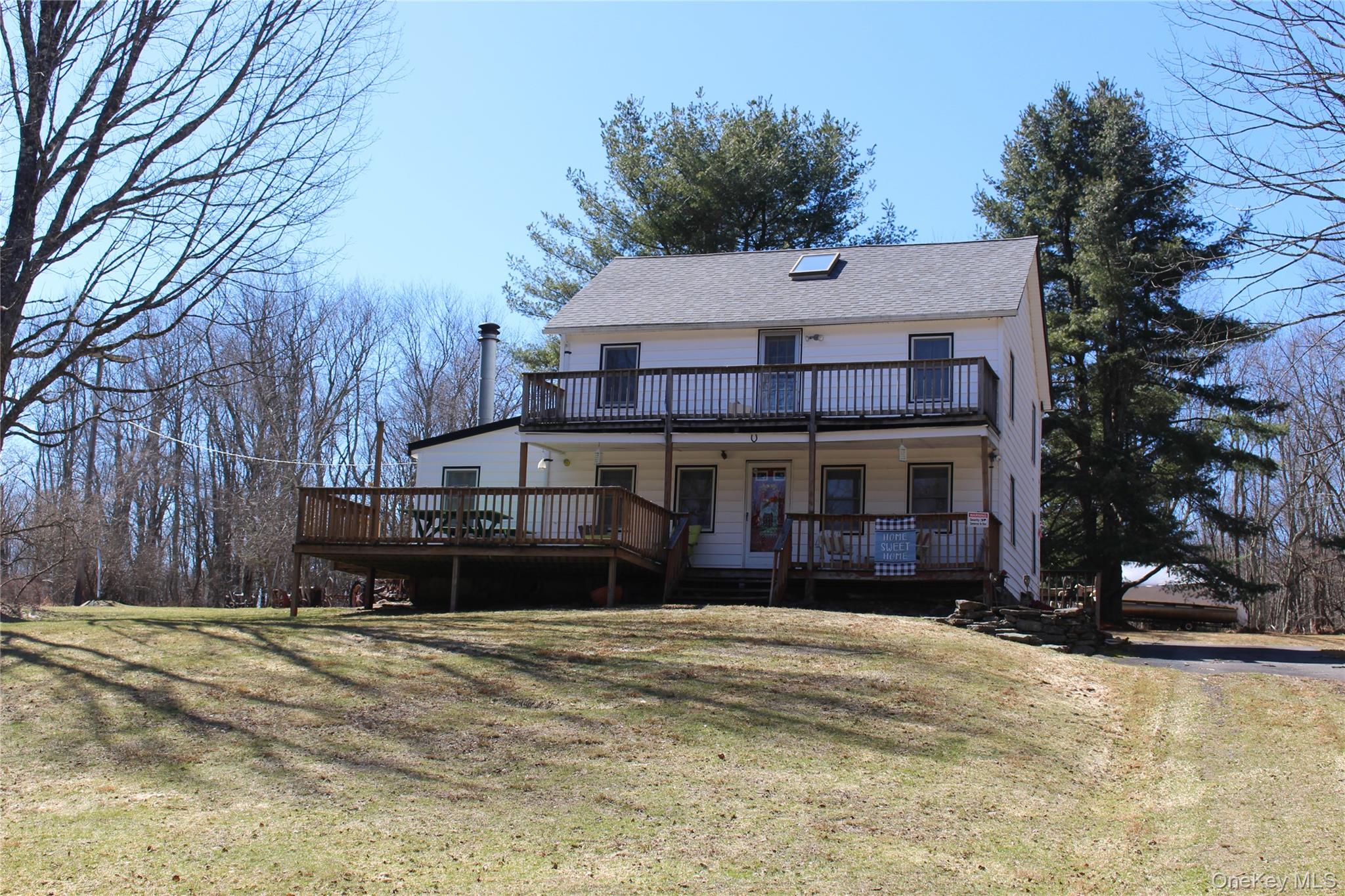 154 Britman Road Mongaup Valley, NY 12762 - Photo 4 of 38 a view of a house with a yard covered in snow