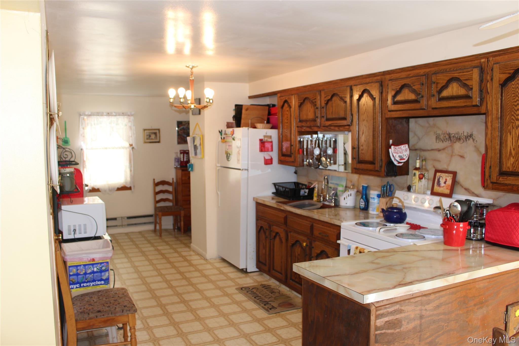 154 Britman Road Mongaup Valley, NY 12762 - Photo 9 of 38 a kitchen that has a lot of cabinets and refrigerator in it