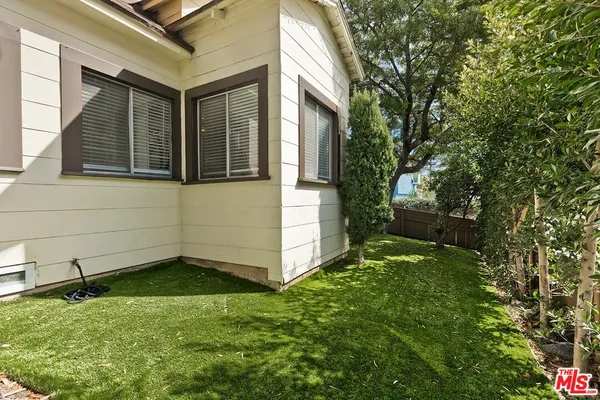 a backyard of a house with lots of green space