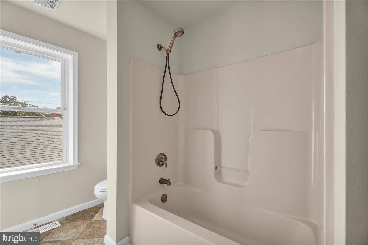 25 Eagle Street Bridgeton, NJ 08302 - Photo 20 of 24 a bathroom with a bath tub with a shower