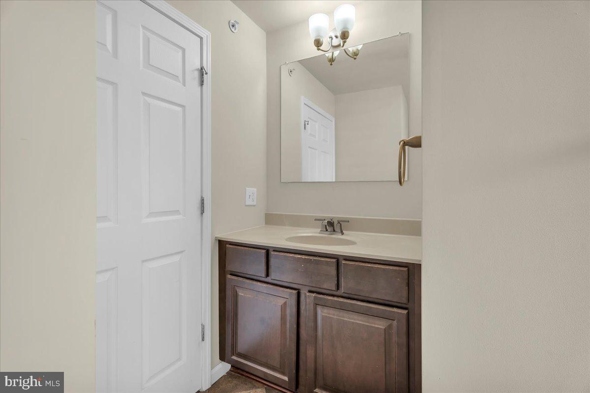 25 Eagle Street Bridgeton, NJ 08302 - Photo 21 of 24 a bathroom with a sink and a mirror