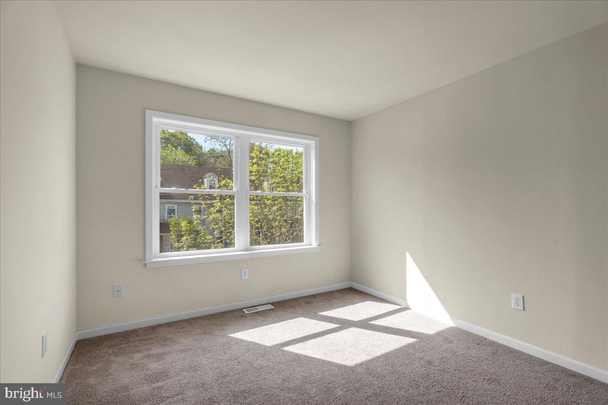 25 Eagle Street Bridgeton, NJ 08302 - Photo 23 of 24 an empty room with a window