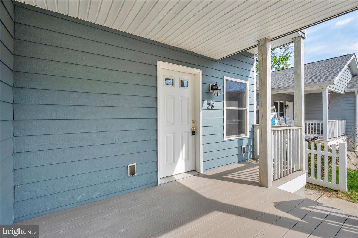25 Eagle Street Bridgeton, NJ 08302 - Photo 3 of 24 a view of a house with a door and wooden walls