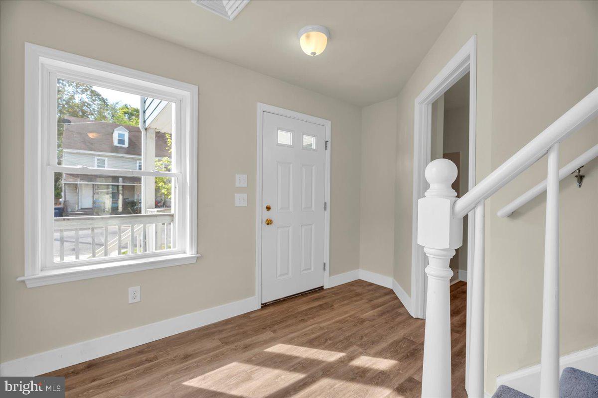 25 Eagle Street Bridgeton, NJ 08302 - Photo 5 of 24 a view of empty room with wooden floor and fan