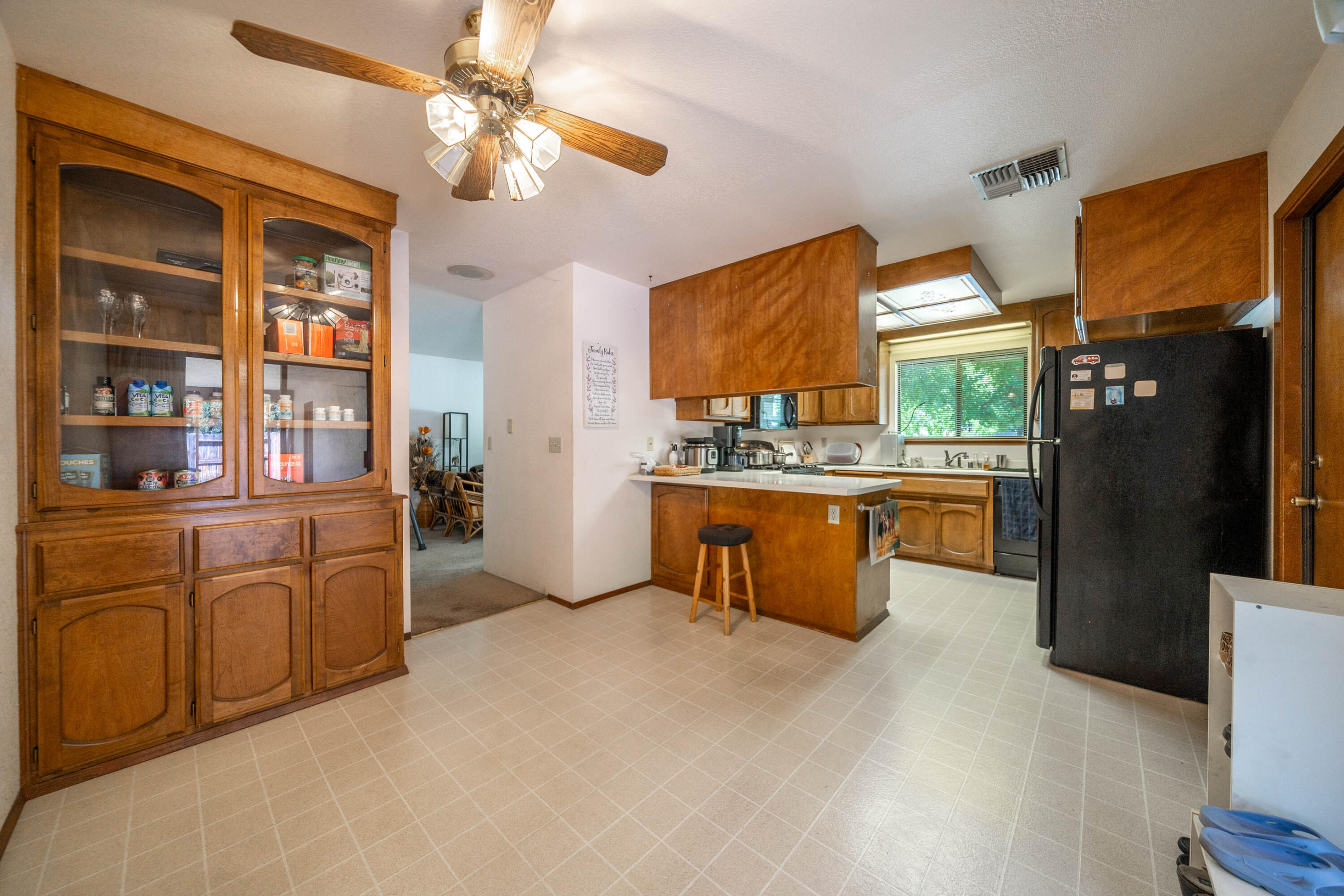 2285 Snow Lane Redding, CA 96003 - Photo 12 of 45 a kitchen with stainless steel appliances kitchen island granite countertop a refrigerator a stove top oven a sink and dishwasher