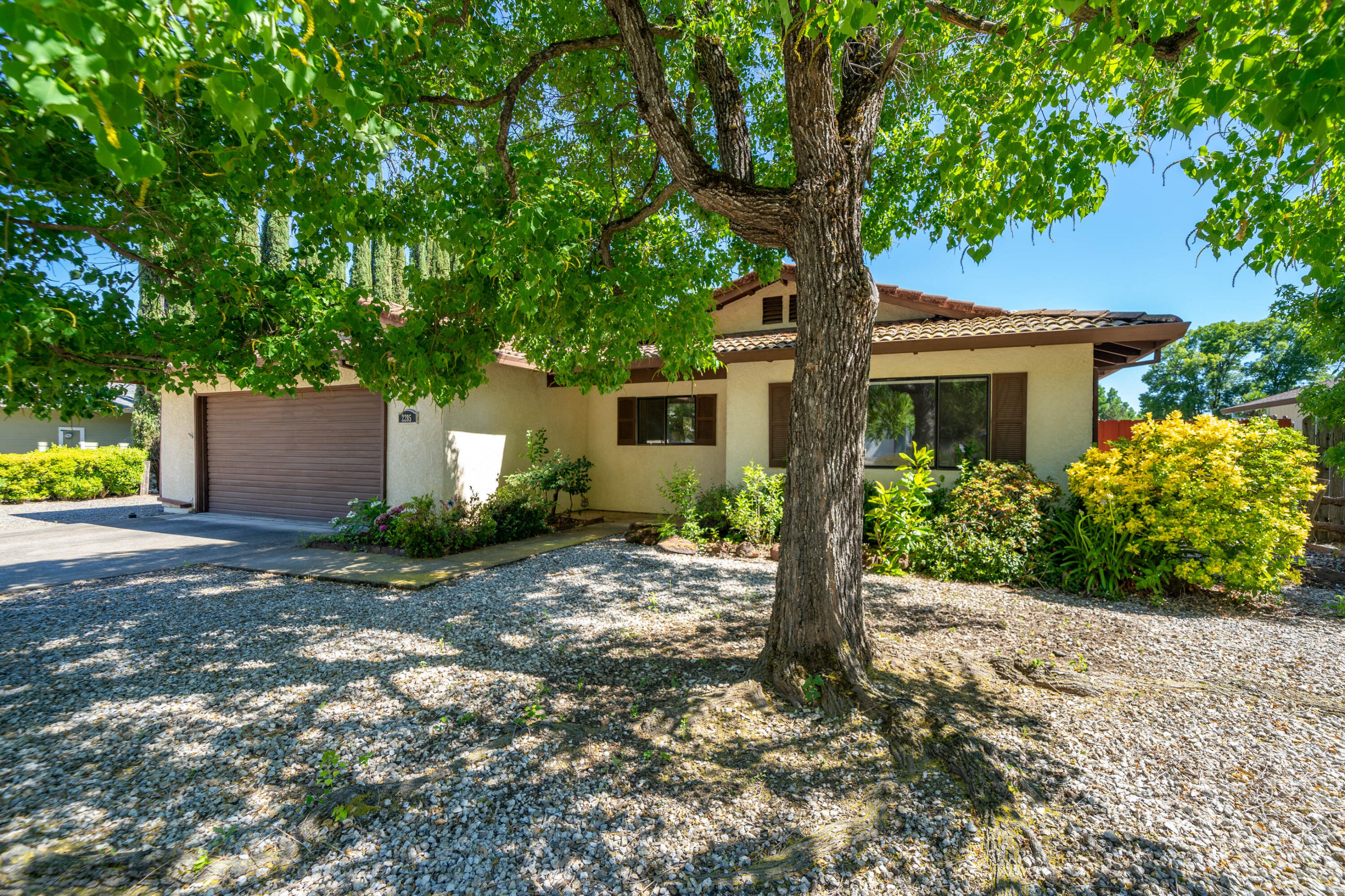 2285 Snow Lane Redding, CA 96003 - Photo 2 of 45 a front view of house with yard and trees around