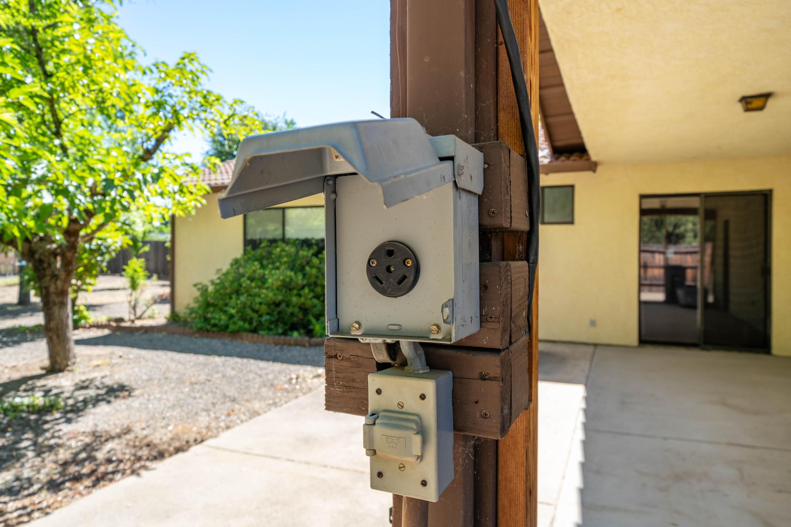 2285 Snow Lane Redding, CA 96003 - Photo 29 of 45 a view of a brick wall with a tree in front of it