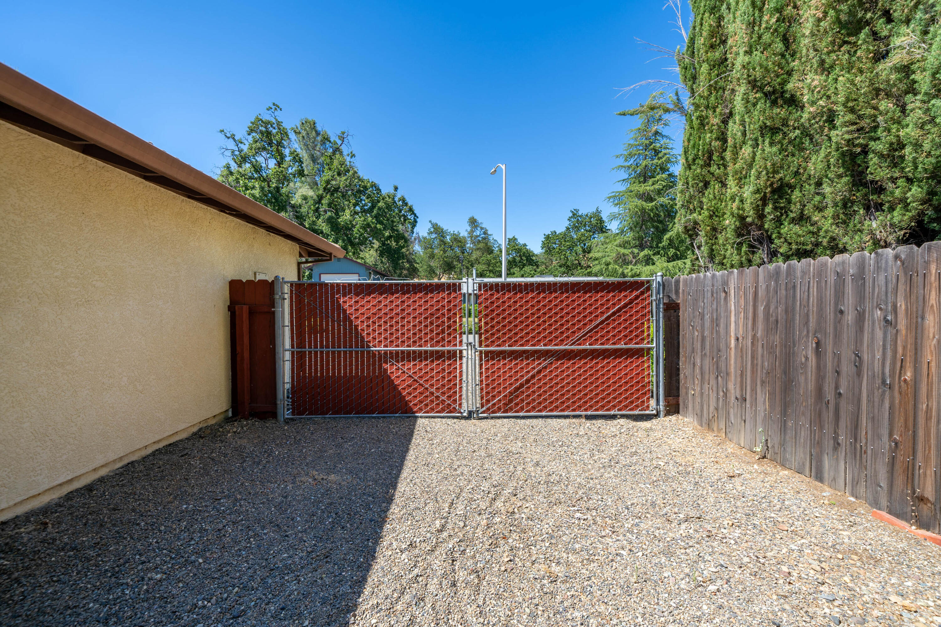 2285 Snow Lane Redding, CA 96003 - Photo 31 of 45 a backyard of a house with lots of green space