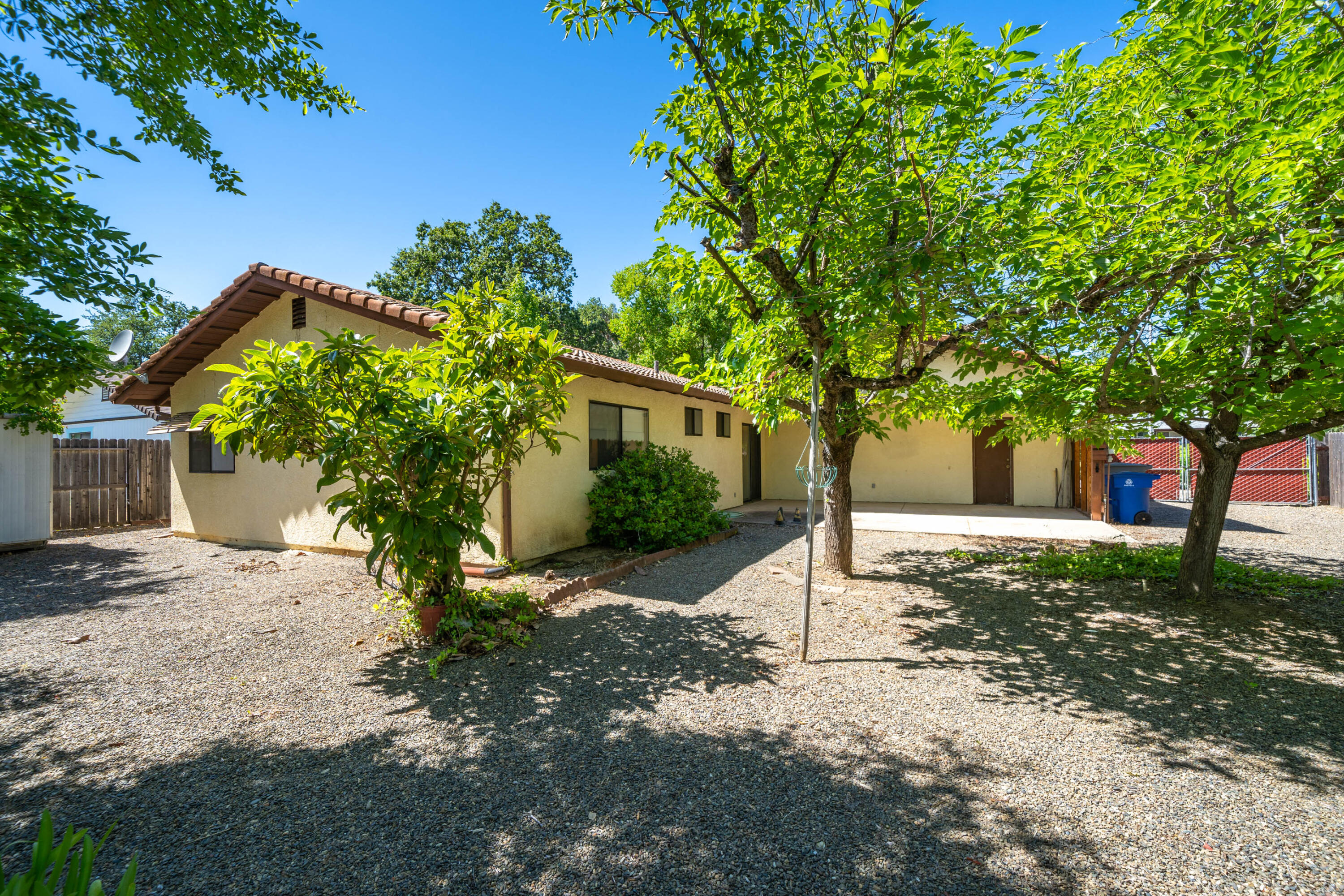 2285 Snow Lane Redding, CA 96003 - Photo 34 of 45 a house with trees in front of it