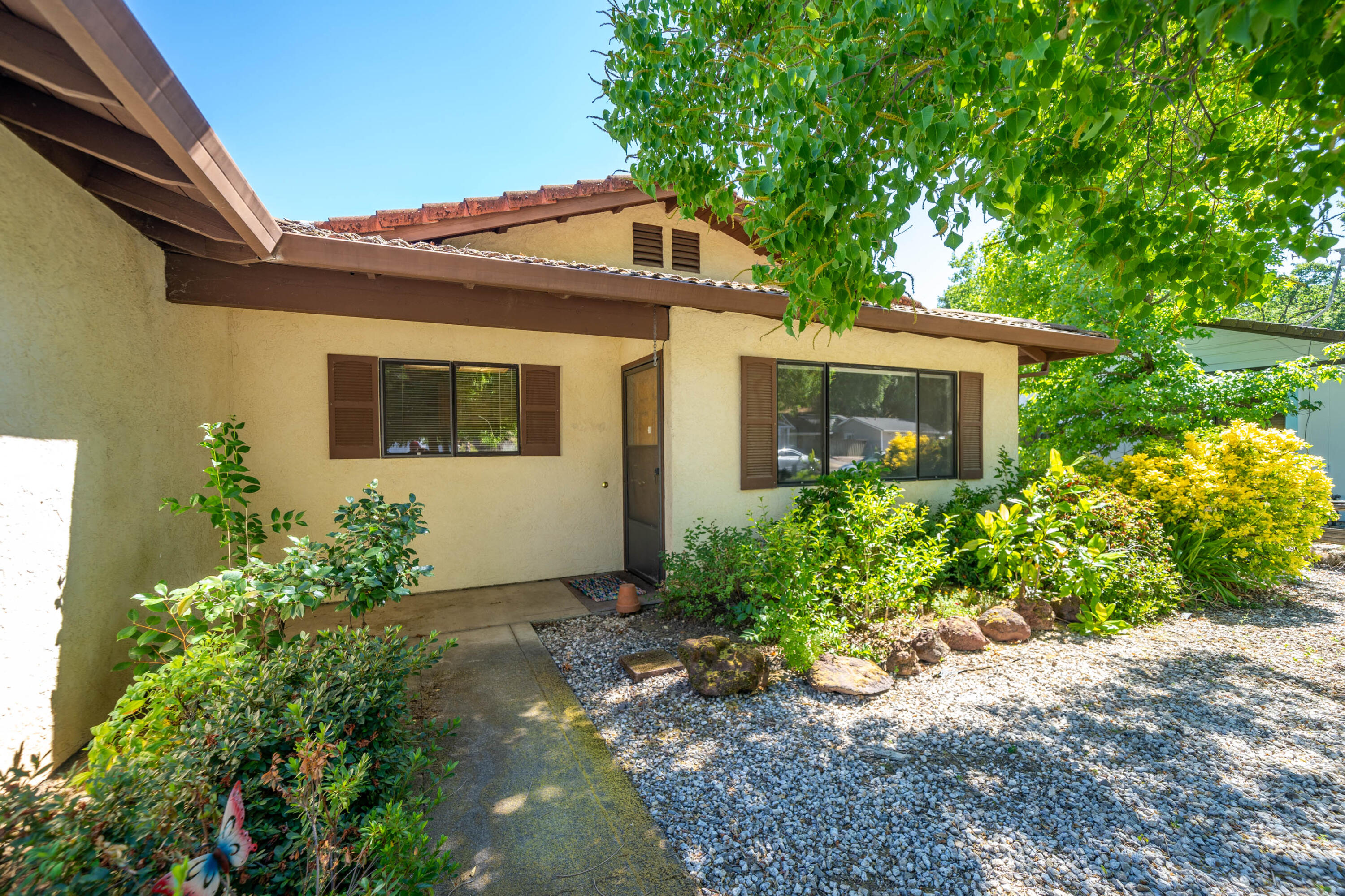 2285 Snow Lane Redding, CA 96003 - Photo 7 of 45 a front view of a house with garden
