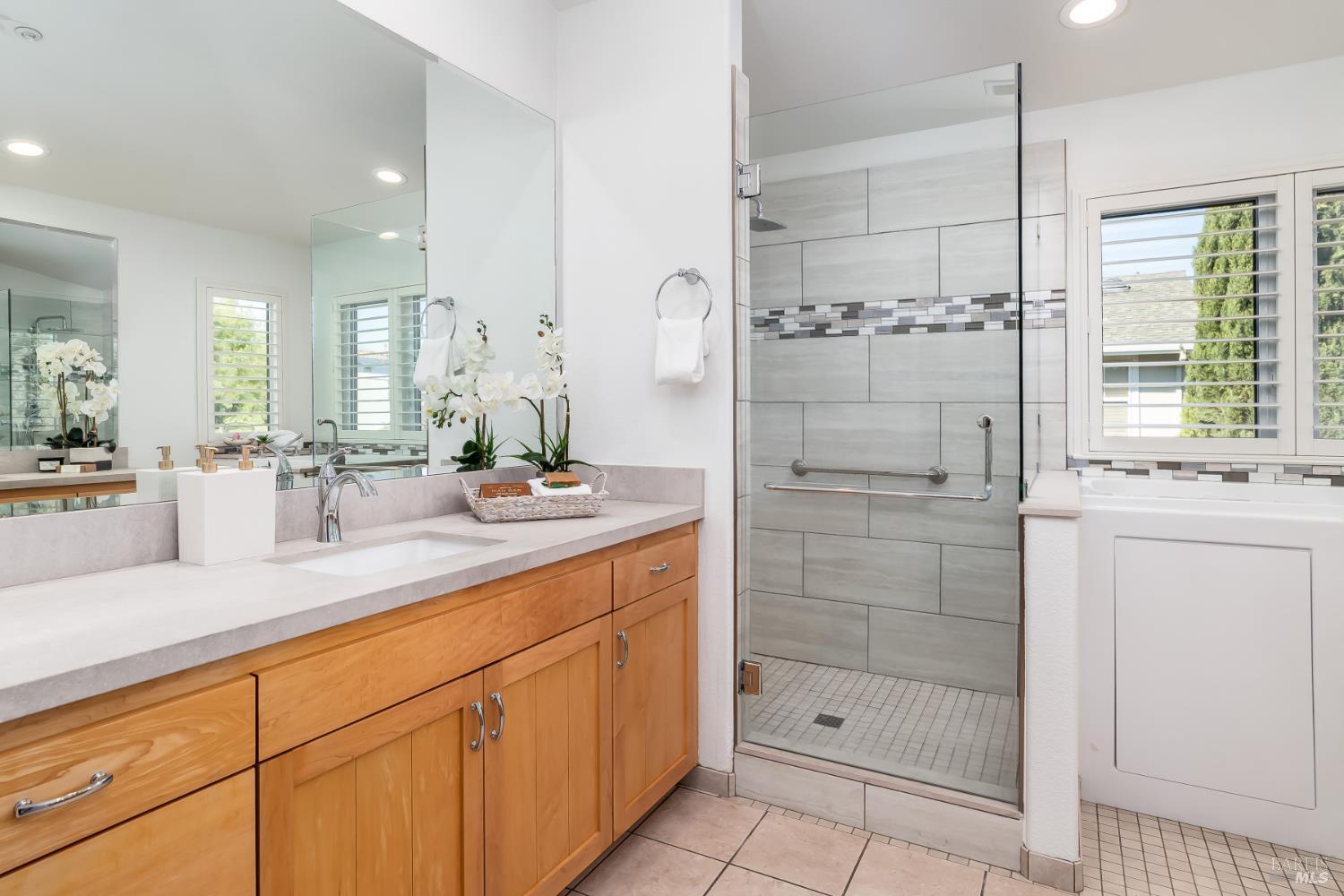 62 Richardson Road Novato, CA 94949 - Photo 17 of 26 a bathroom with a shower sink and mirror
