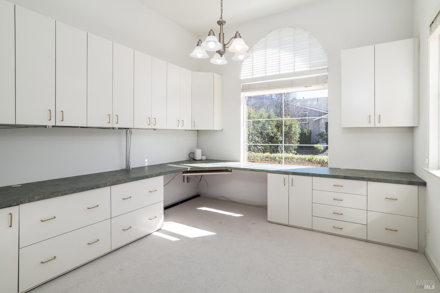 62 Richardson Road Novato, CA 94949 - Photo 22 of 26 a kitchen with granite countertop white cabinets white stainless steel appliances and a window