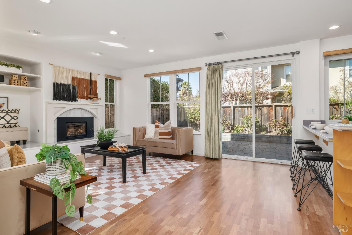 62 Richardson Road Novato, CA 94949 - Photo 5 of 26 a living room with furniture a fireplace and a flat screen tv
