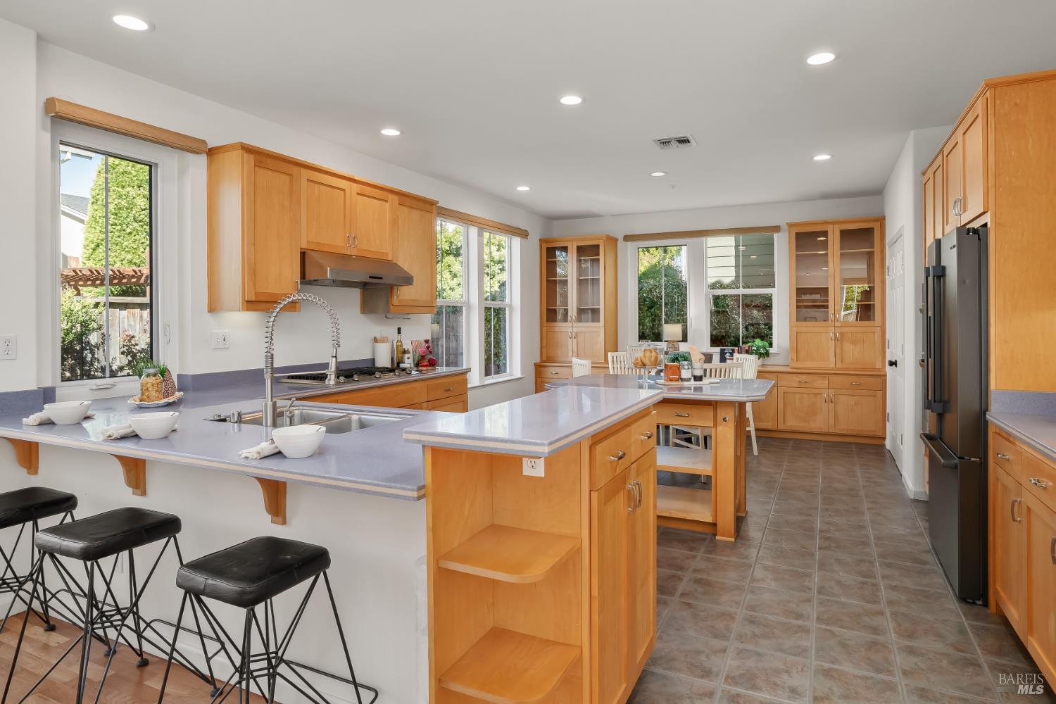 62 Richardson Road Novato, CA 94949 - Photo 8 of 26 a kitchen with granite countertop a sink and a refrigerator