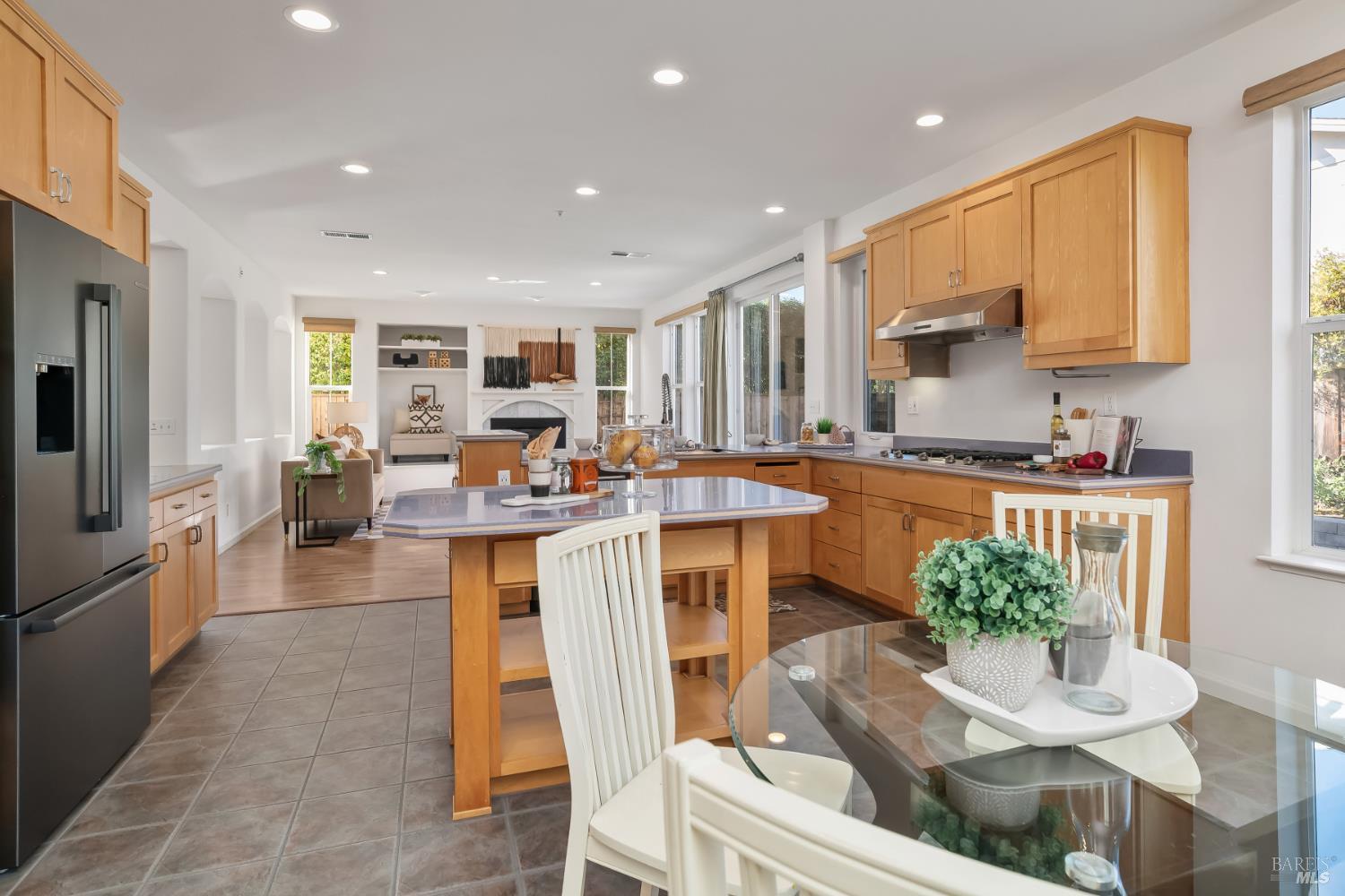 62 Richardson Road Novato, CA 94949 - Photo 10 of 26 a kitchen with stainless steel appliances kitchen island granite countertop a refrigerator a stove a sink dishwasher and white cabinets with wooden floor