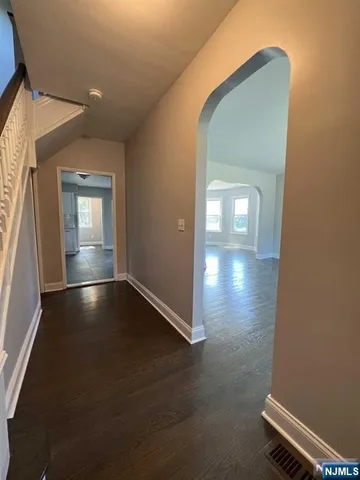 a view of a swimming pool with a big yard and large trees