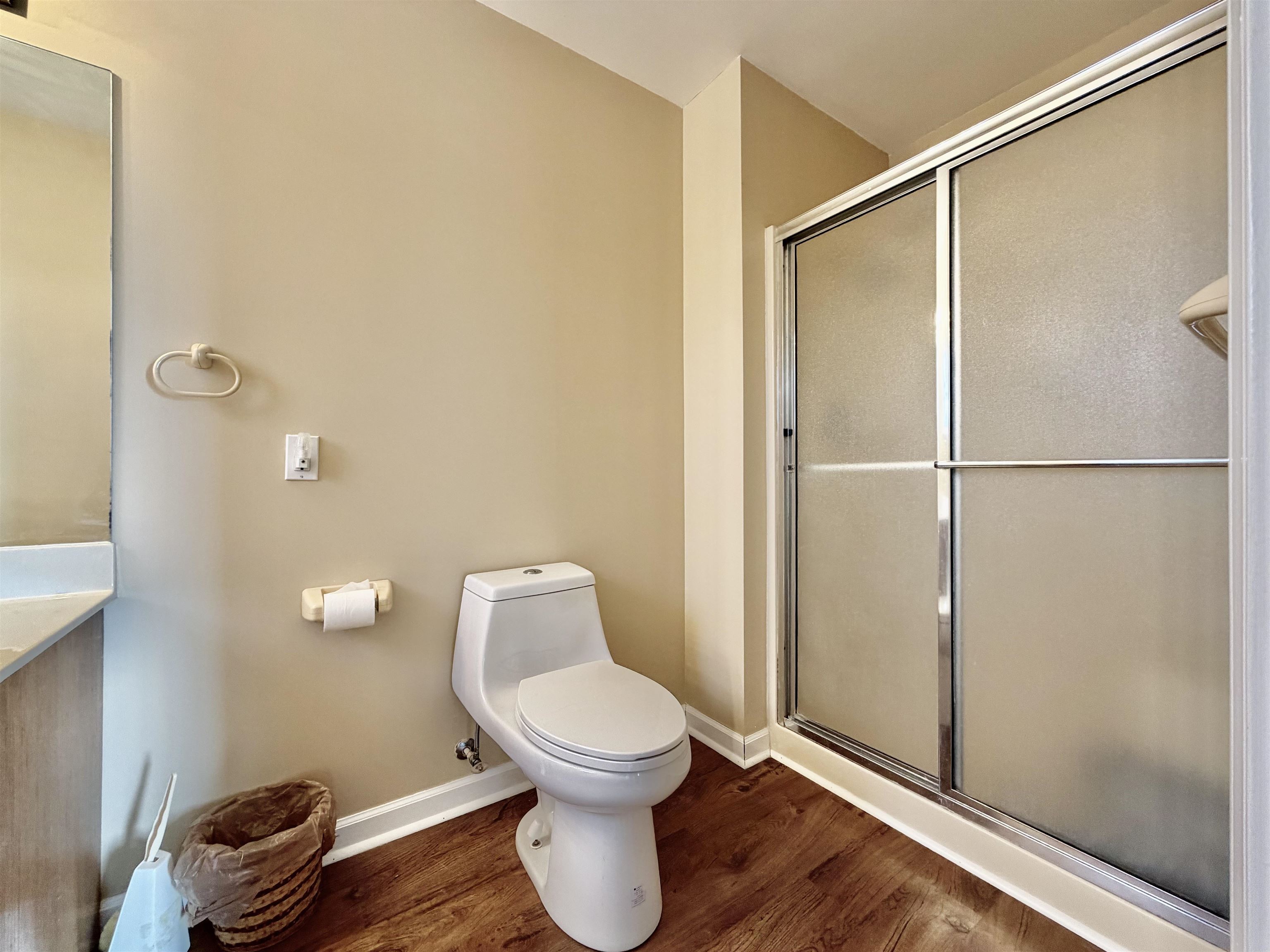 1086 Sloan Road Burlison, TN 38015 - Photo 17 of 24 Bathroom with a shower stall and dark wood-type flooring