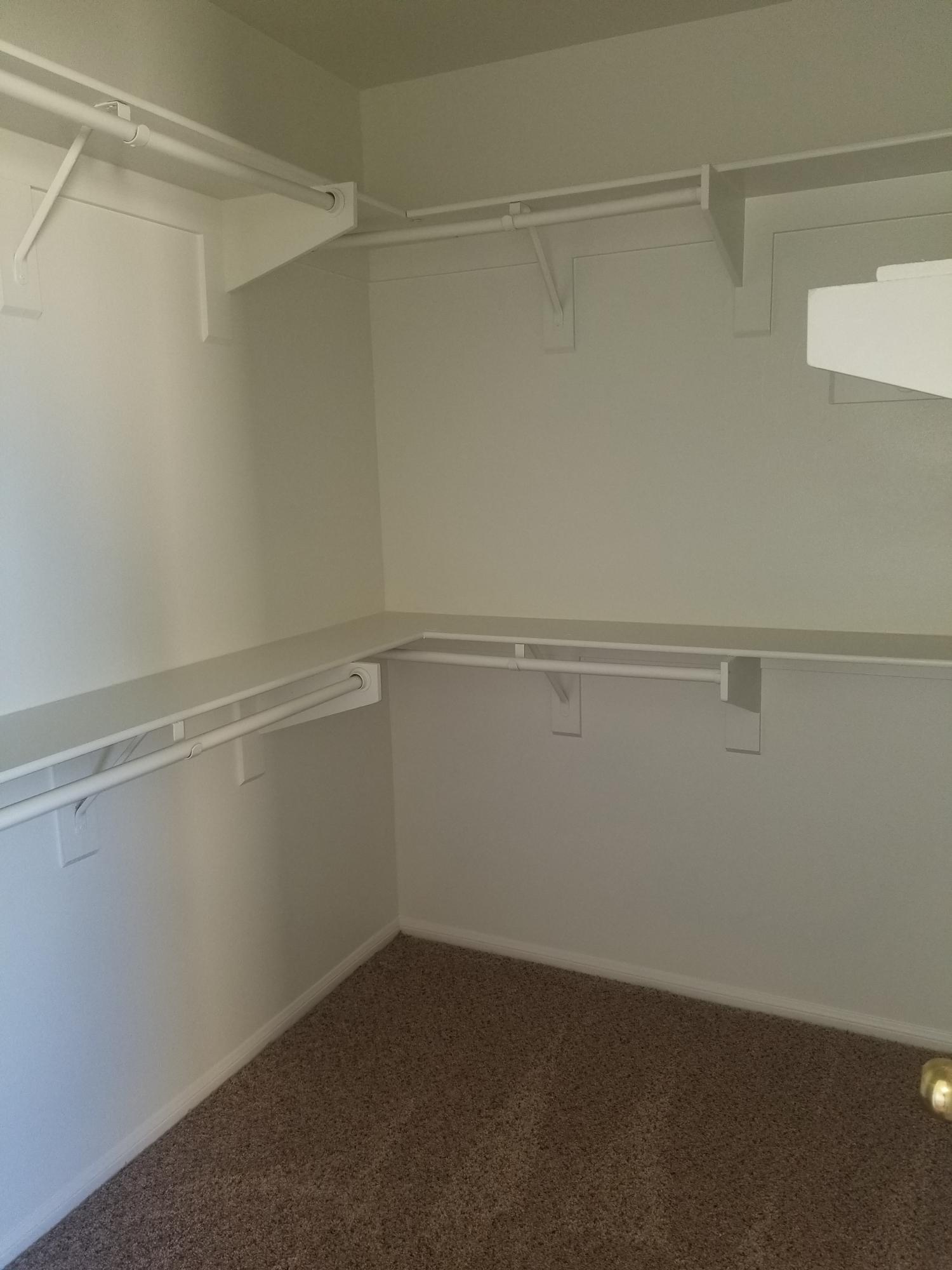 43487 30th Street West, Unit 2 Lancaster, CA 93536 - Photo 11 of 16 a view of an empty walk in closet