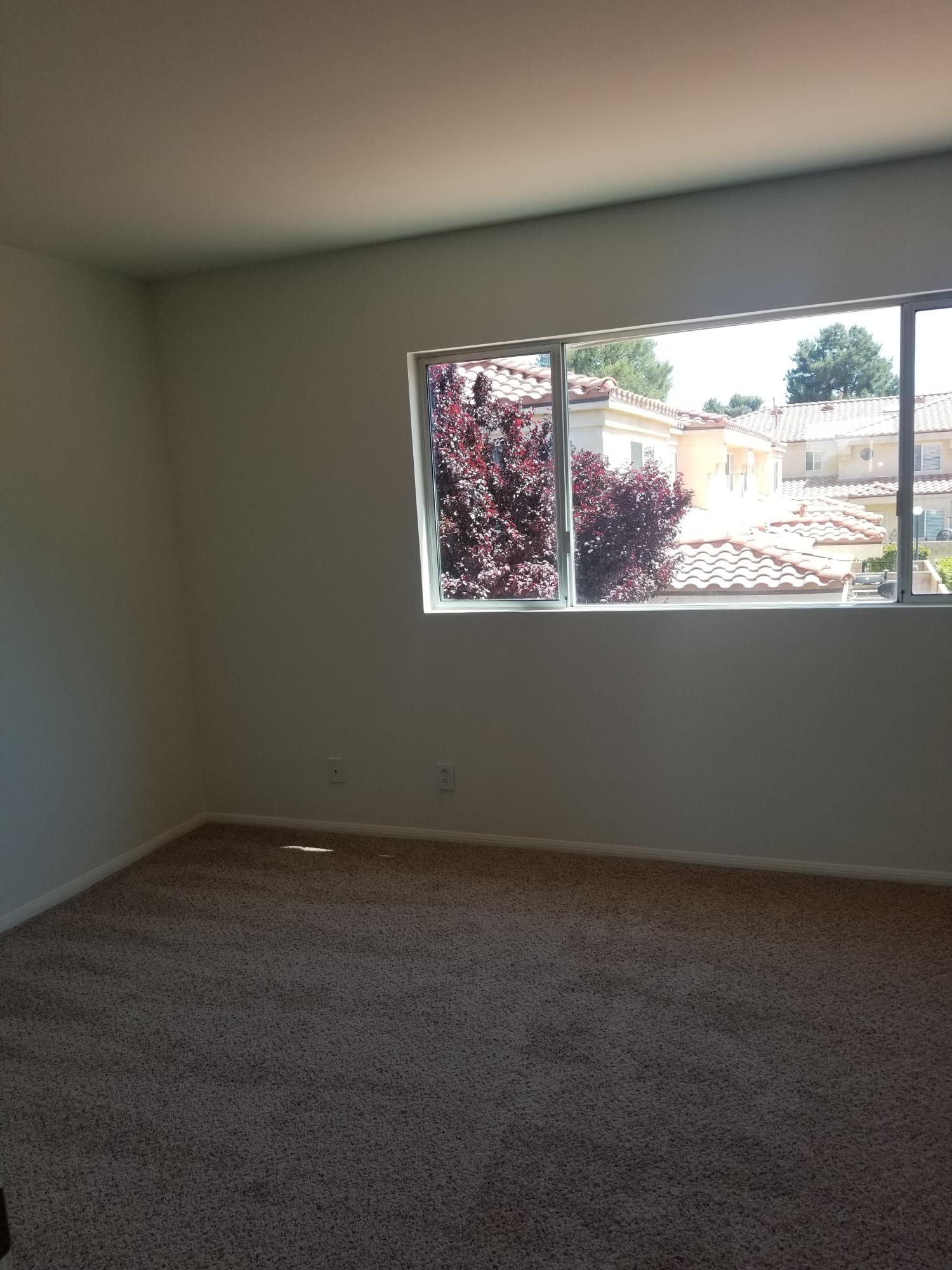 43487 30th Street West, Unit 2 Lancaster, CA 93536 - Photo 12 of 16 an empty room with a window